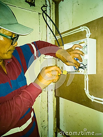 Closeup of electrician works Stock Photo